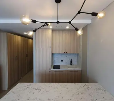 a room with a kitchen with a marble counter top at Cozy flat 911 in Vilnius