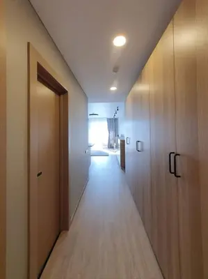 an empty hallway with a door and a hallwayngth at Cozy flat 911 in Vilnius