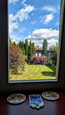 three pizzas sitting on a table in front of a window at Trakai Castle View Villa55 in Trakai