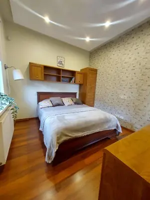 a bedroom with a large bed in a room at Trakai Castle View Villa55 in Trakai