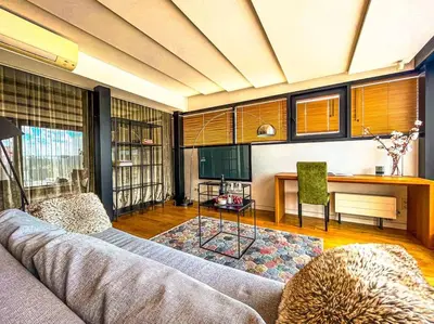 a living room with a couch and a table at Luxury Apartments with Large Terrace in City Center in Vilnius