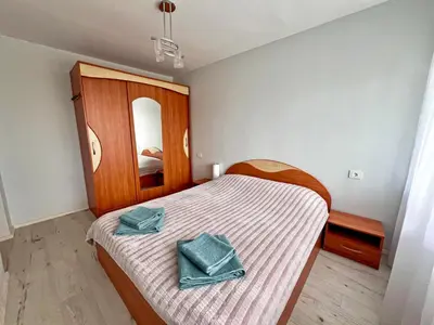a bedroom with a bed with two towels on it at Tytuvėnai-trumpalaikė nuoma in Tytuvėnai