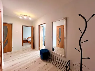 a room with two mirrors and a suitcase on the floor at Tytuvėnai-trumpalaikė nuoma in Tytuvėnai
