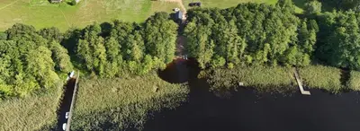 an aerial view of a river with trees at Jack namai 1 in Puodžiai