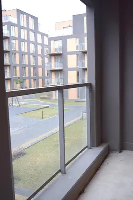 a window in a building with a view of a street at Cozy apartment located near to Paupys in Vilnius