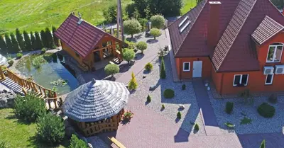 a model of a house with a pool and a yard at Tytuvos upelio Krantinė in Tytuvėnai