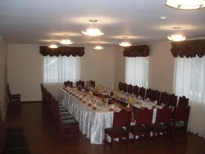 a long dining room with a long table and chairs at Suraučių Svečių Namai in Aukštadvaris