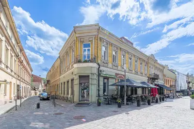 a building on a street in a city at Jazz Old Town apartment with AC in Kaunas