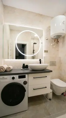 a bathroom with a sink and a toilet and a mirror at Red House Corner in Marijampolė