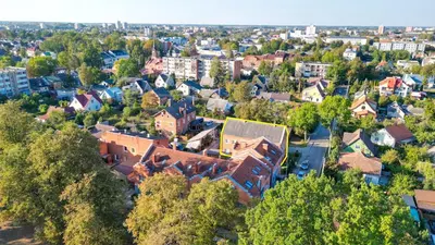 an aerial view of a town with houses and trees at Red House Corner in Marijampolė