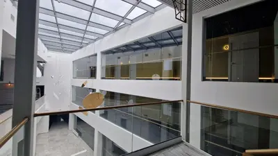 a view of a building with a glass ceiling at Suncity Hotel & SPA in Šiauliai