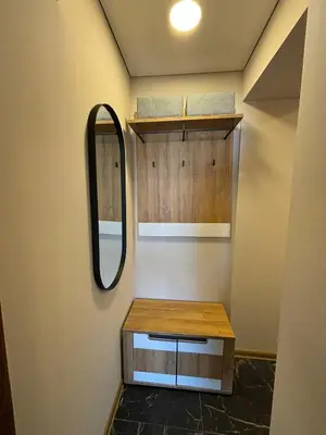 a bathroom with a vanity and a mirror on the wall at Suite Dreams in Kėdainiai