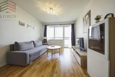 a living room with a couch and a table at Sausio 13 Apartamentas in Vilnius