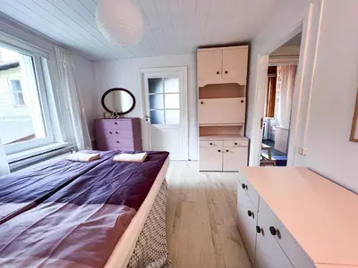a bedroom with a bed and a desk in it at GreenHill House in Kaunas