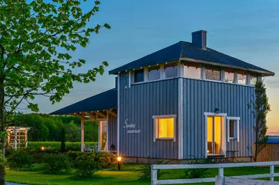 a tiny house with a blue siding at Cozy stay by Kaunas vila 9Vėjai in Girininkai