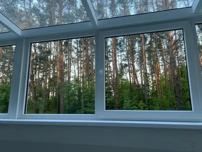 a window in a room with a view of trees at Peaceful Apartment Lazdynai in Vilnius