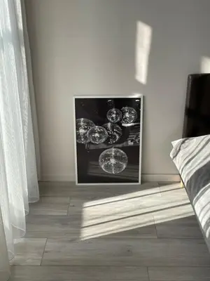 a white room with a television on a wall at Karoliniškių apartamentai in Vilnius