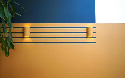 a wall with blue and yellow stripes at Daina Apartments Self check-in in Vilnius