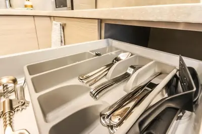a sink with two faucets in a kitchen at Ruby Rest in Druskininkai