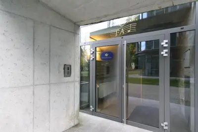 an entrance to a building with a revolving door at Ruby Rest in Druskininkai