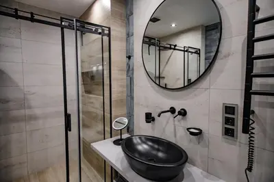 a bathroom with a sink and a mirror at Hales Old Town Urban Apartments in Vilnius