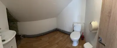 a small bathroom with a toilet and a sink at Svečių Namai Darželis in Šiauliai