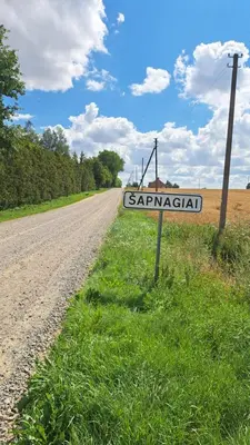 a street sign on the side of a road at Jaukus butas arti Šiaulių miesto in Šiauliai