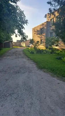 an empty road in front of a building at Jaukus butas arti Šiaulių miesto in Šiauliai