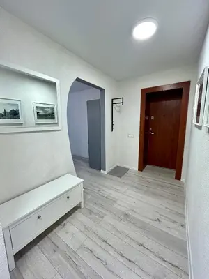 a room with a hallway with a bench and a door at Vivist apartments in Druskininkai