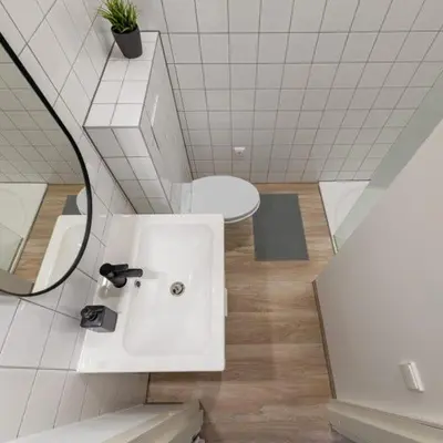 a white bathroom with a sink and a mirror at Studio on Laisves Aleja, Central Kaunas - Self Check In in Kaunas