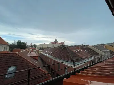 a view of roofs of buildings in a city at Old Town loft in Vilnius