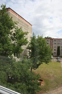 a view from a window of a building with trees at Butterfly apartment in Šiauliai