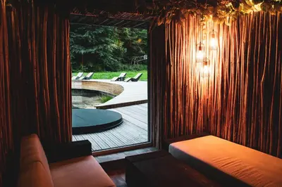 a room with a window with a view of a pool at Sodyba Mėnulio Slėnis in Padubysys