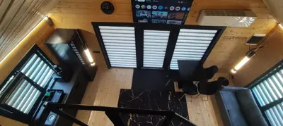 an overhead view of a living room with windows at Naujai įrengtas atostogų namelis su kubilu ir pirtimi papildomai in Anykščiai