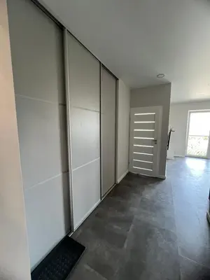 an empty room with a door and a keyboard at Bright and cozy place to stay in Vilnius