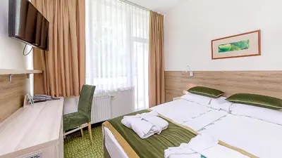 a hotel room with a bed and a television at Medical SPA 
