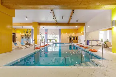 a large swimming pool in a large building at Medical SPA 
