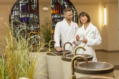 a man and woman standing in front of sinks at Medical SPA 