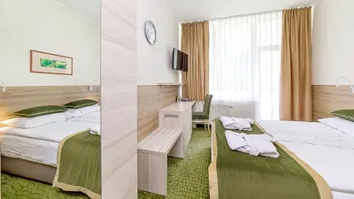 a hotel room with two beds and a desk at Medical SPA 