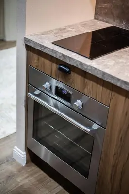 a stainless steel oven in a kitchen with a counter at Renaissance Apartments by Reside Baltic in Vilnius