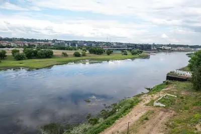 a view of a river with a city in the background at AMJ Royal Apartments - 115 - Black Rubby in Kaunas