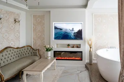 a living room with a couch and a fireplace at AMJ Royal Apartments - 120 - Royal Classic in Kaunas