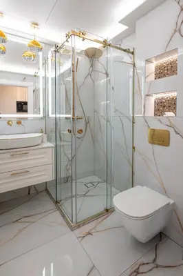 a bathroom with a glass shower and a toilet at AMJ Royal Apartments - 120 - Royal Classic in Kaunas