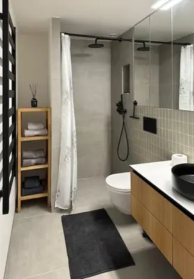 a bathroom with a toilet and a sink and a shower at Sunny Cosy Home in Kaunas