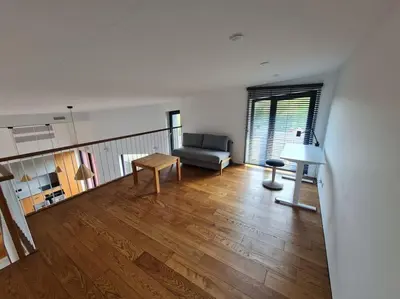 a living room with a couch and a table at Sunny Cosy Home in Kaunas