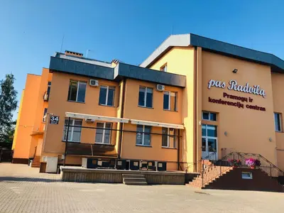 a building with a sign on the side of it at Pas Radvila in Kaišiadorys