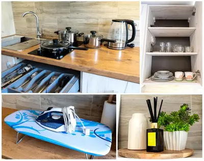 a kitchen with a stove with pots and pans at Park's Edge apartment in Kaunas
