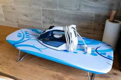 a camera sitting on top of a surfboard at Park's Edge apartment in Kaunas