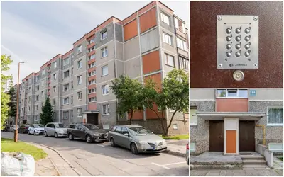 a building with cars parked in front of it at Monic Apartments in Šiauliai