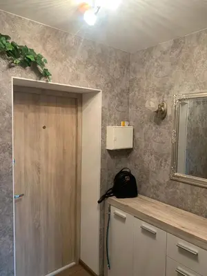 a room with a door and a mirror on the wall at Vytauto 36a in Zarasai